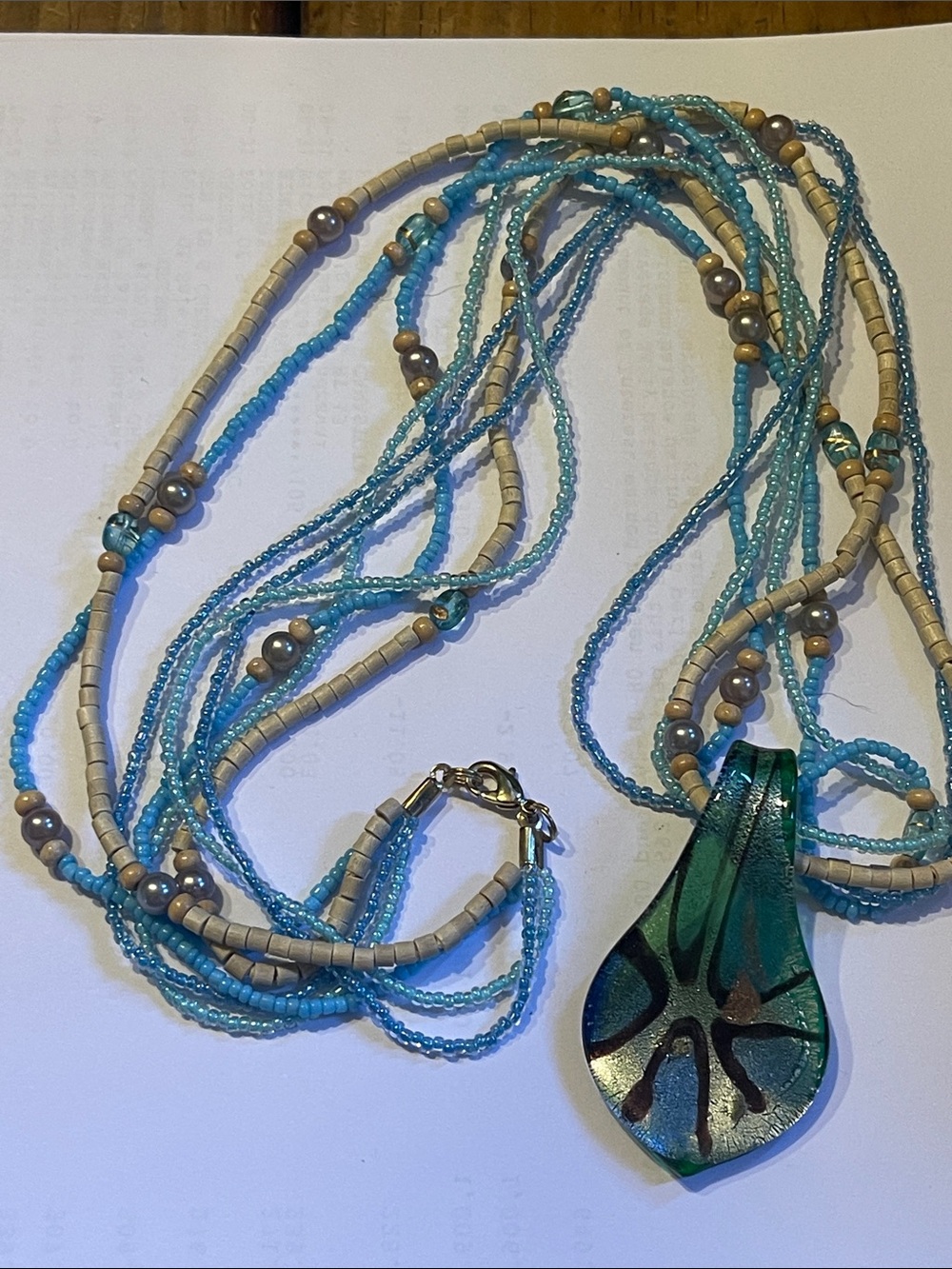 Beaded Blue and Tan necklace Glass pendant 30”
